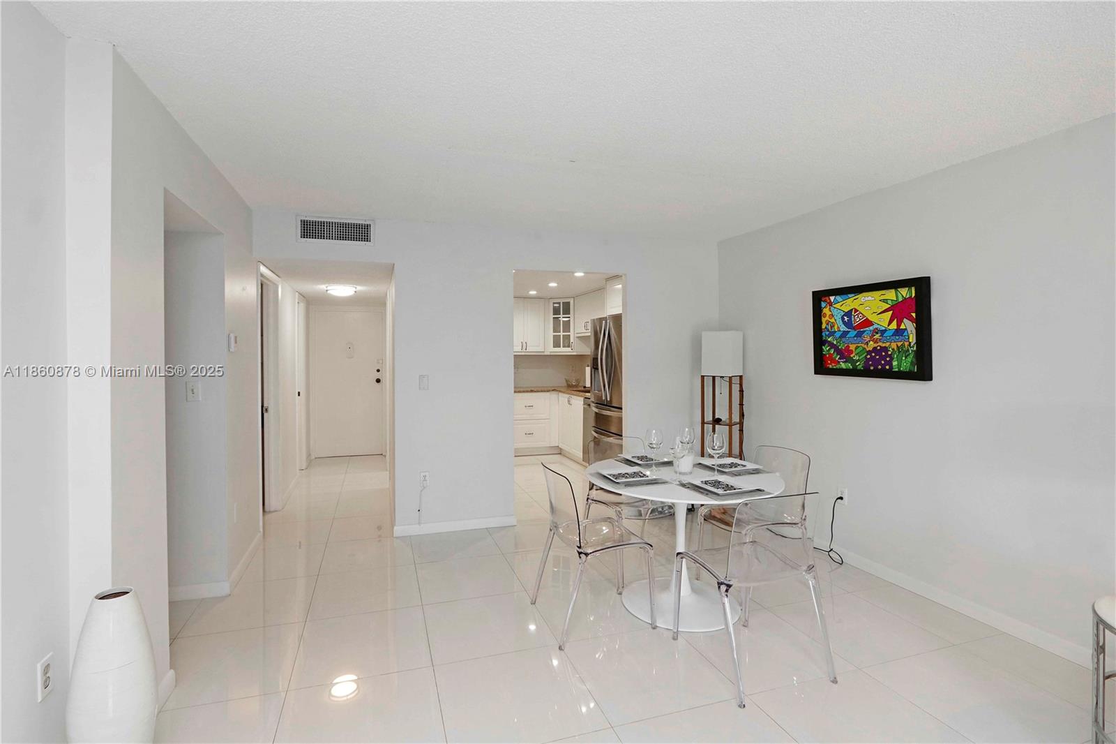 210 Seaview Drive, Unit 207 Key Biscayne, FL 33149 - Photo 5 of 24 a view of a livingroom with furniture and white walls