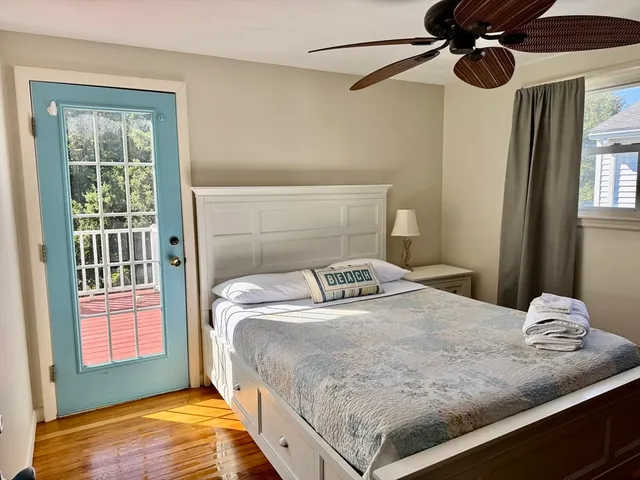 a bedroom with a bed and window
