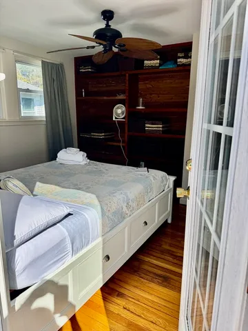 a bedroom with a bed and a mirror