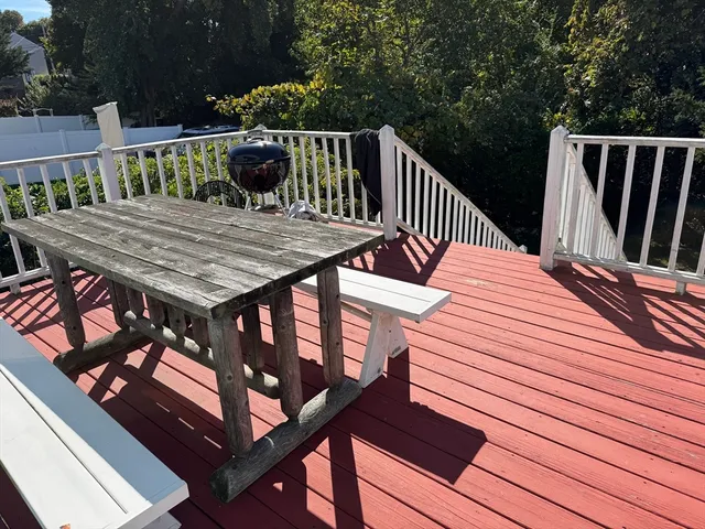 a view of a wooden deck with a bench