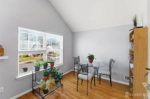 a dining room with furniture and window