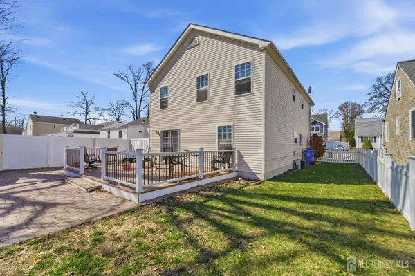 a view of a house with a yard and porch