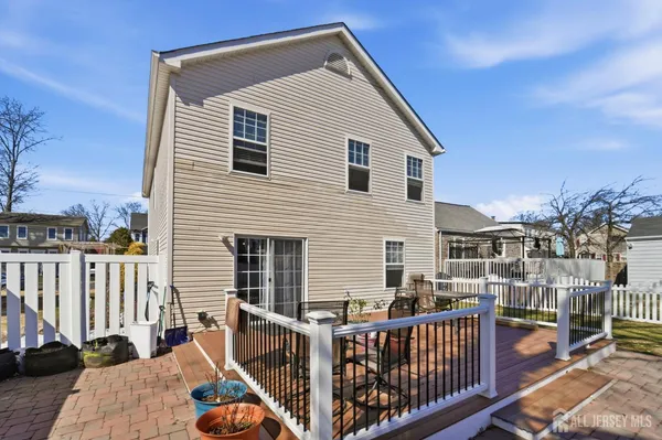 a view of a house with wooden deck
