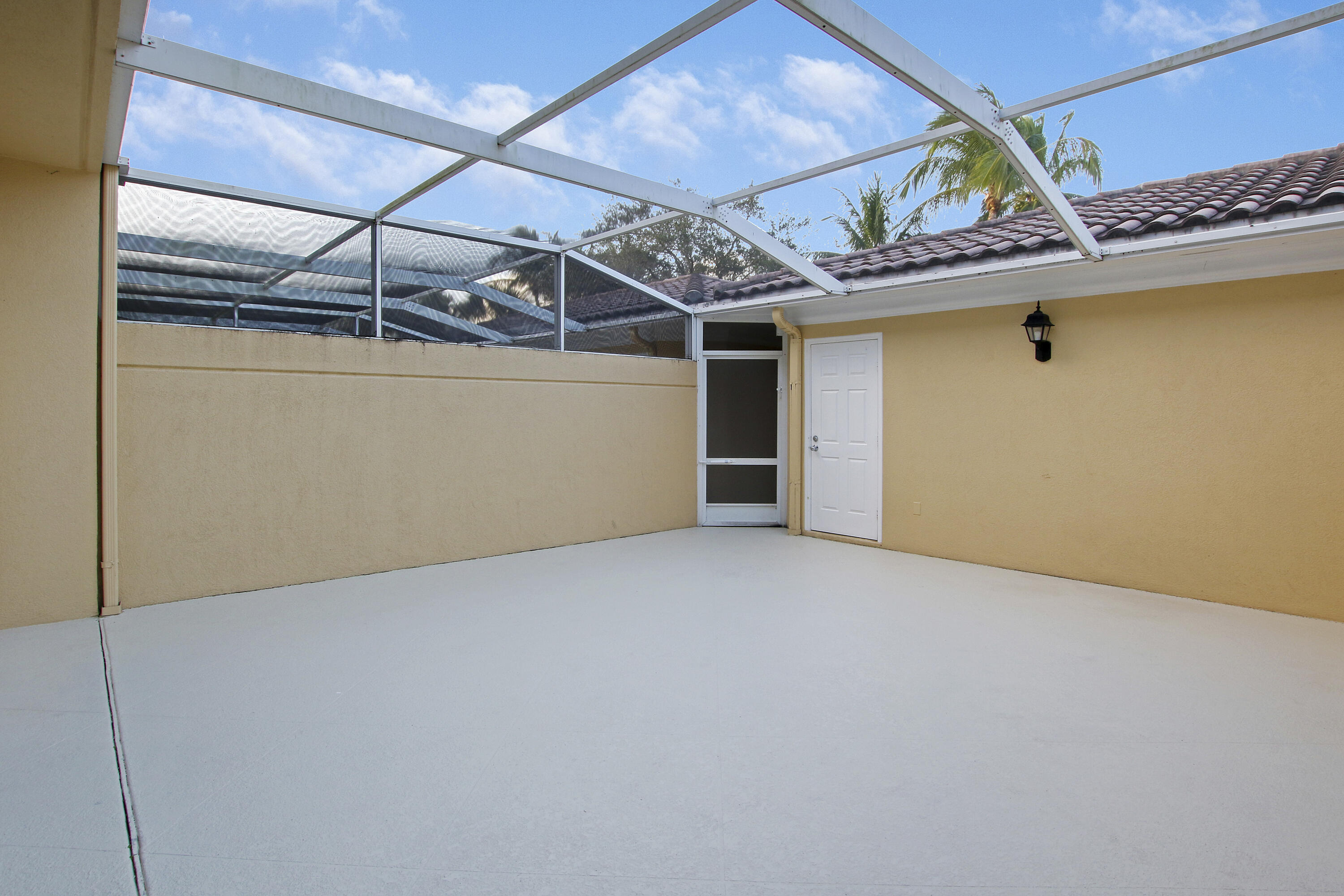 1931 Frederick Small Road Jupiter, FL 33458 - Photo 36 of 46 PATIO WITH GARAGE ACCESS