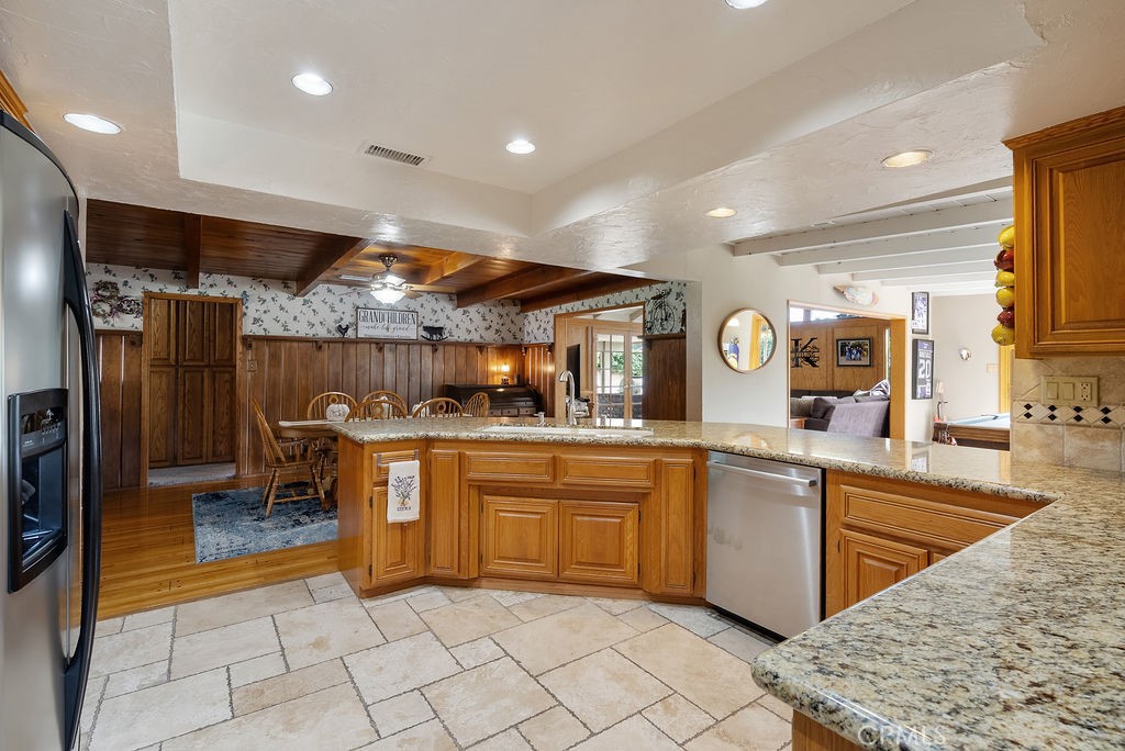 772 East Northridge Avenue Glendora, CA 91741 - Photo 11 of 35 a kitchen with stainless steel appliances granite countertop a sink and cabinets