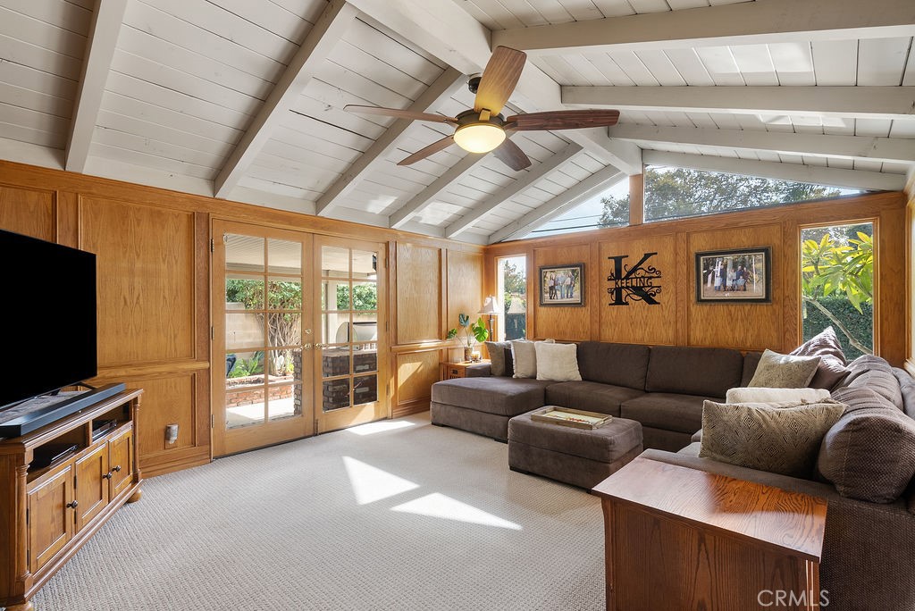 772 East Northridge Avenue Glendora, CA 91741 - Photo 14 of 35 a living room with furniture a ceiling fan a flat screen tv and a window