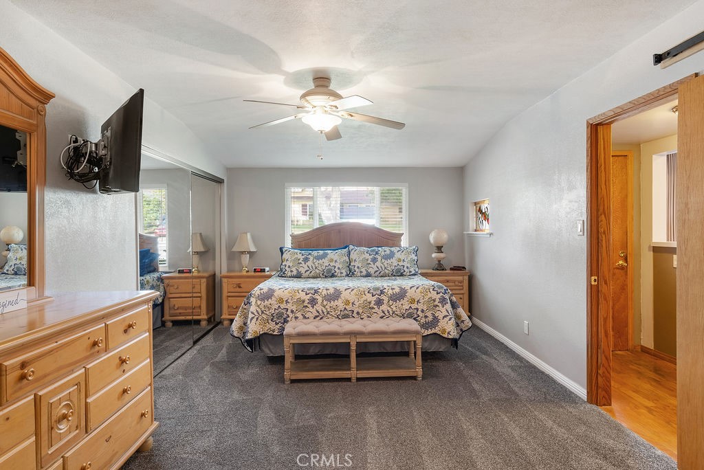 772 East Northridge Avenue Glendora, CA 91741 - Photo 20 of 35 a bed room with a bed and a chandelier