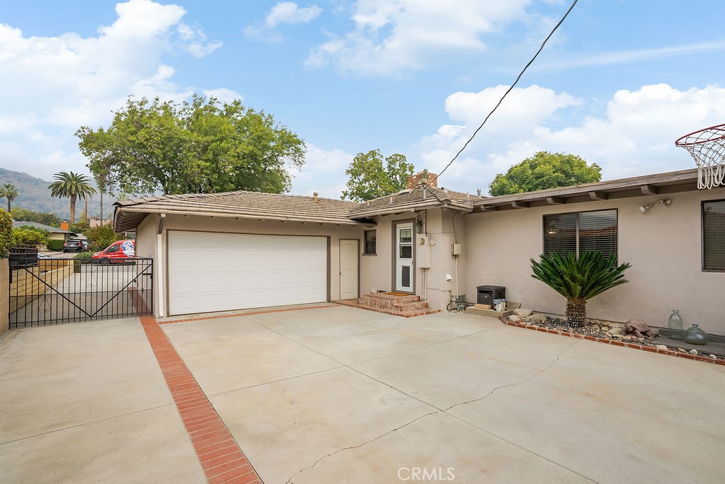 772 East Northridge Avenue Glendora, CA 91741 - Photo 28 of 35 a view of a house with a patio and potted plants