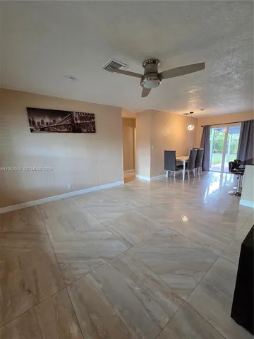 an entryway of a room with chandelier
