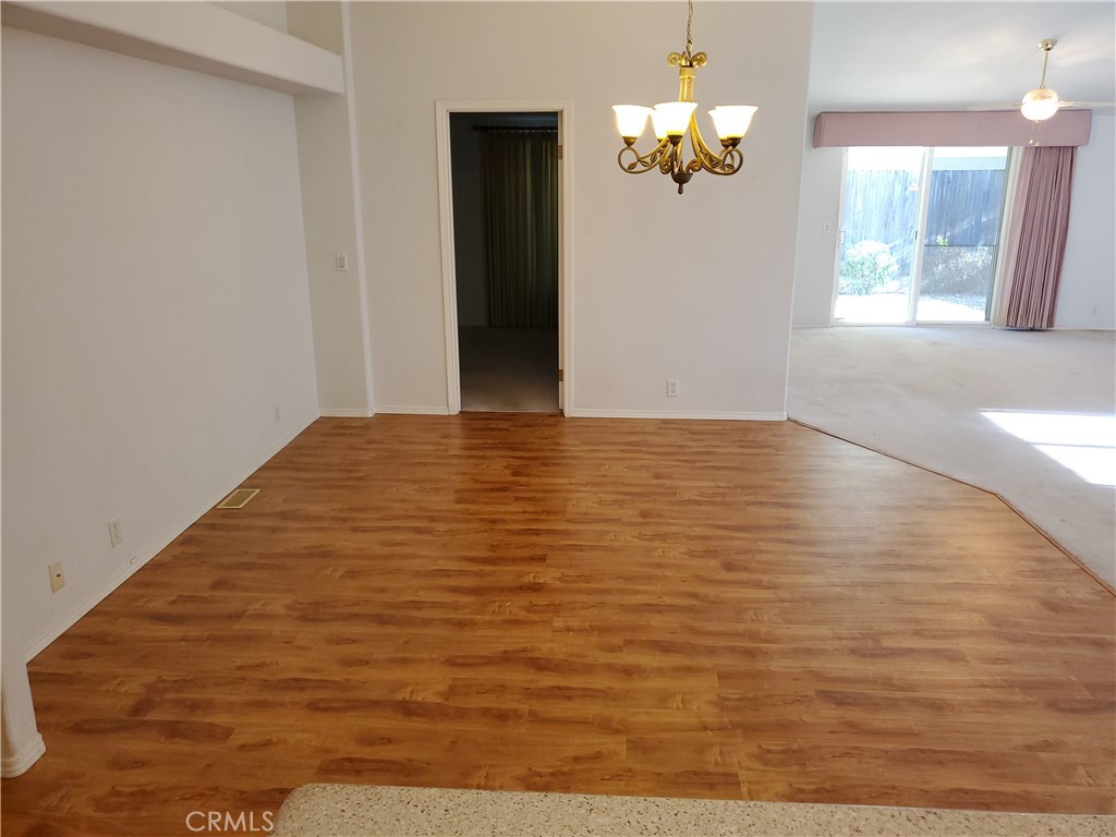 76 Orchardcrest Drive Oroville, CA 95965 - Photo 13 of 24 a view of empty room with wooden floor