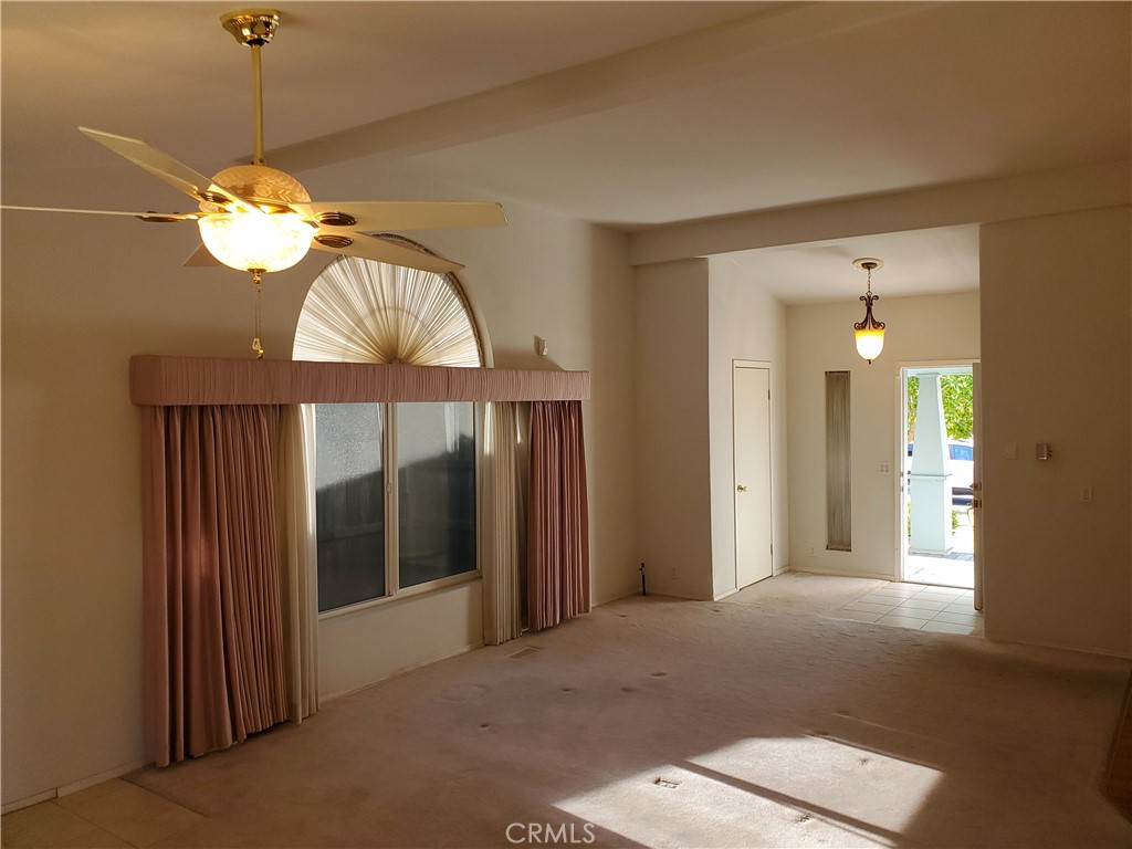 76 Orchardcrest Drive Oroville, CA 95965 - Photo 7 of 24 a view of a chandelier fan and a livingroom with a chandelier