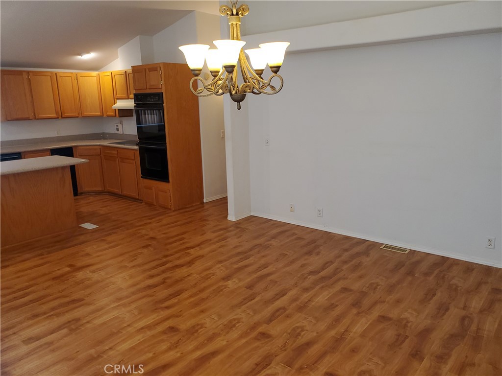 76 Orchardcrest Drive Oroville, CA 95965 - Photo 9 of 24 a view of a kitchen with stainless steel appliances granite countertop a refrigerator and a stove top oven