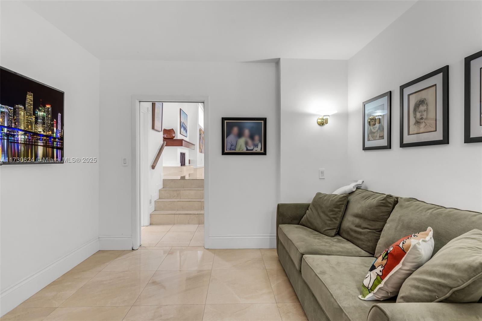 9260 Southwest 101st Street Miami, FL 33176 - Photo 24 of 67 a living room with furniture and a book shelf