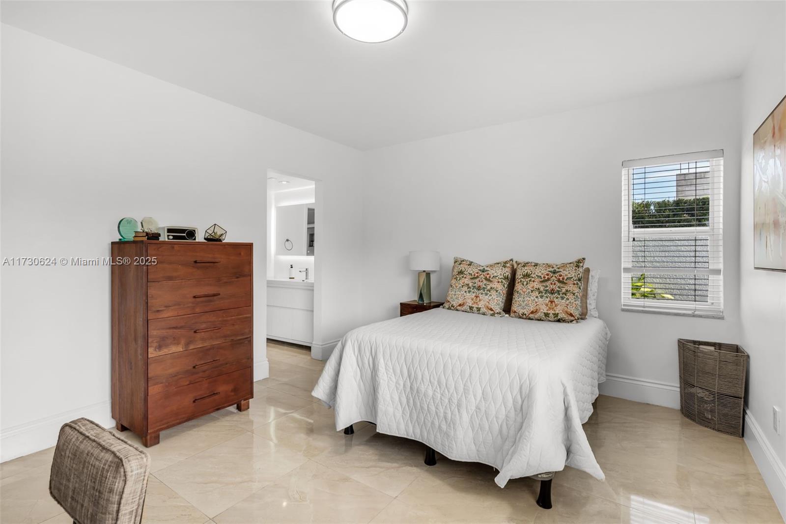 9260 Southwest 101st Street Miami, FL 33176 - Photo 30 of 67 a bedroom with a bed and a couch