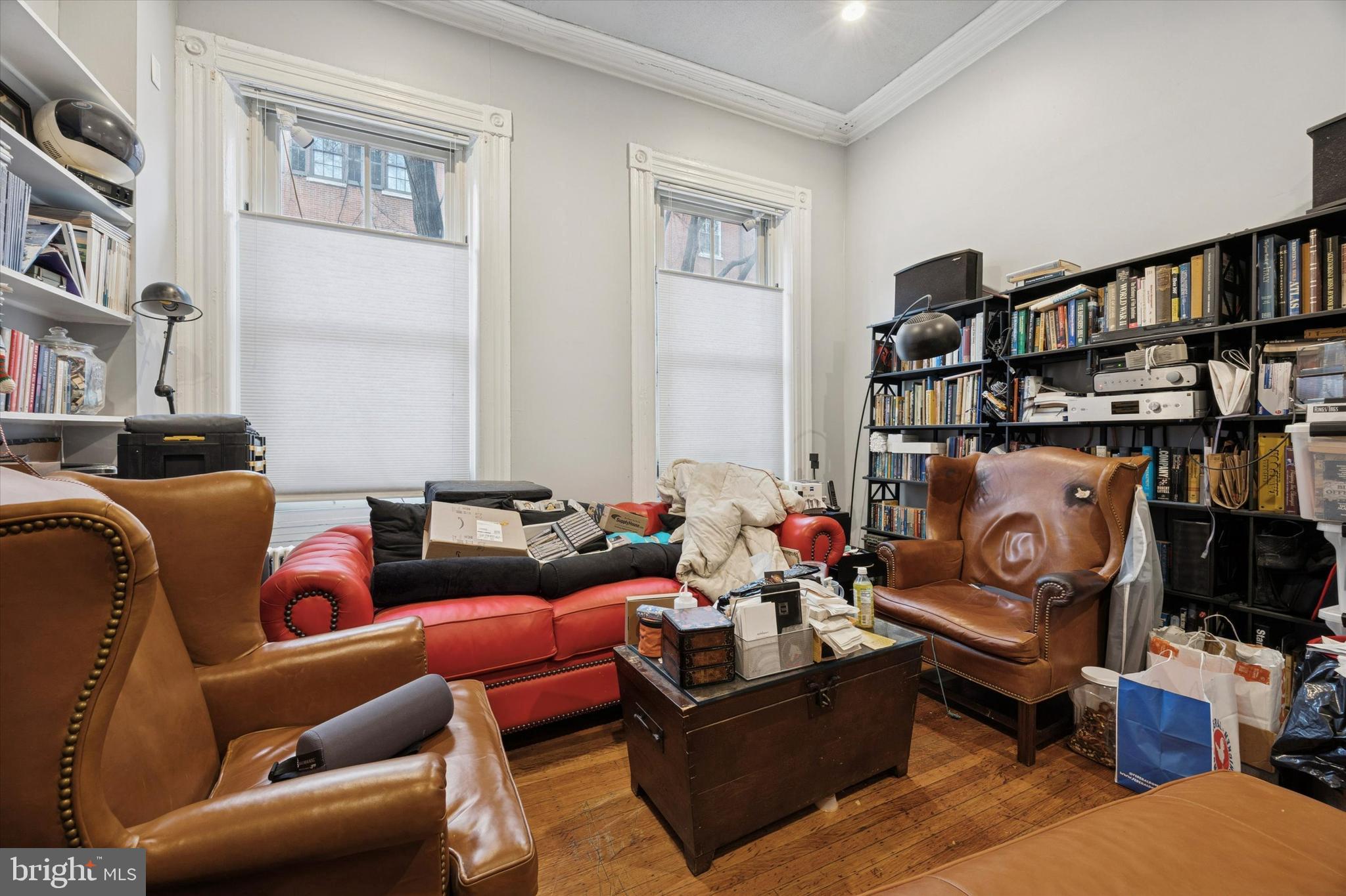 916 Clinton Street Philadelphia, PA 19107 - Photo 3 of 13 a living room with furniture cabinets and book shelf