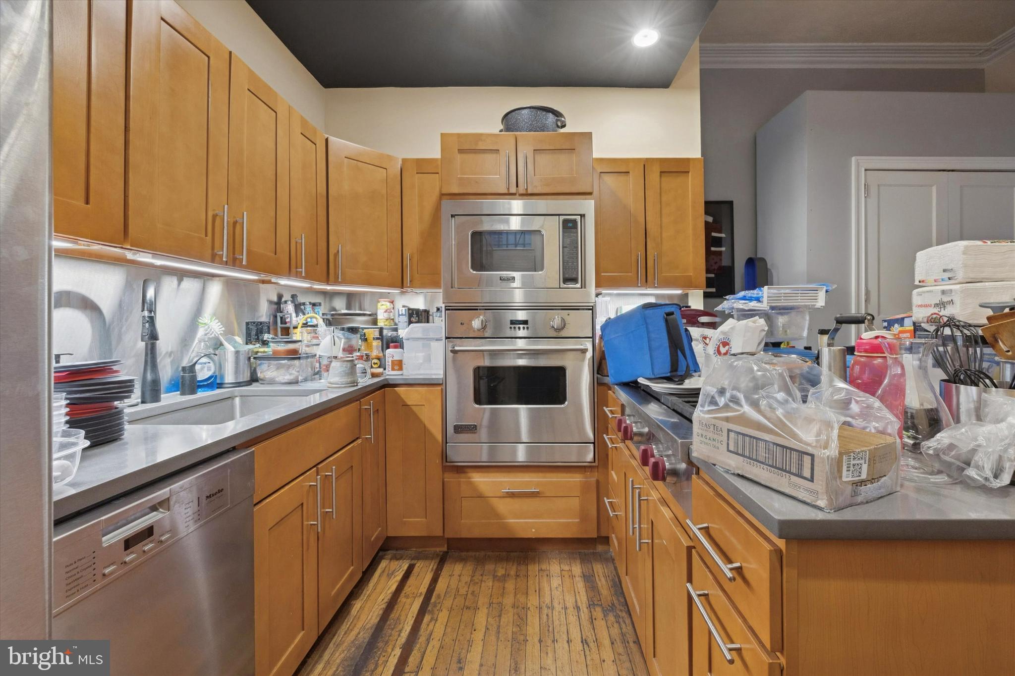 916 Clinton Street Philadelphia, PA 19107 - Photo 5 of 13 a kitchen with sink cabinets and window