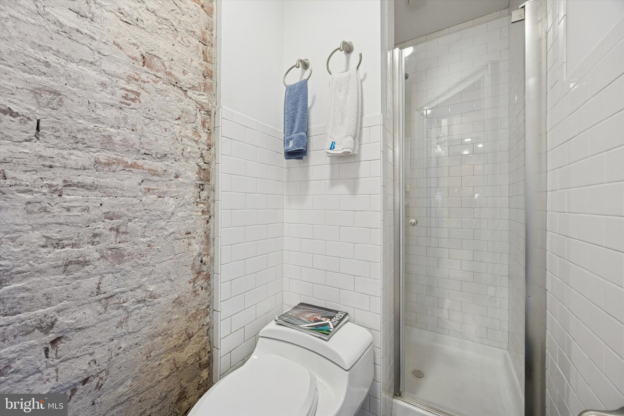916 Clinton Street Philadelphia, PA 19107 - Photo 6 of 13 a bathroom with a toilet and a shower