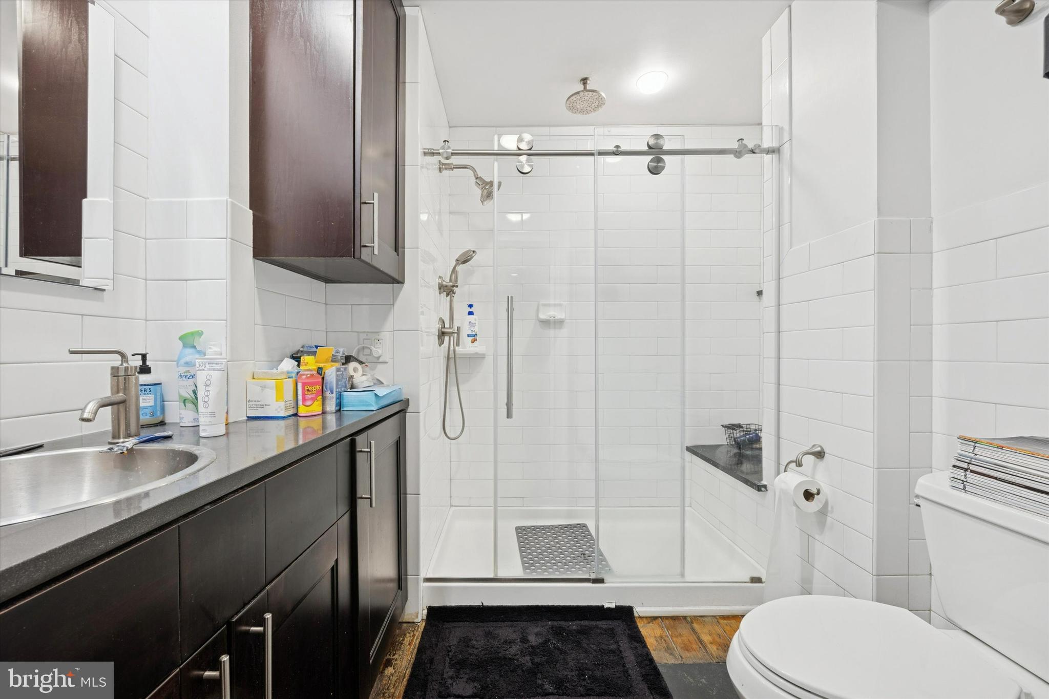 916 Clinton Street Philadelphia, PA 19107 - Photo 9 of 13 a bathroom with a sink a toilet and shower