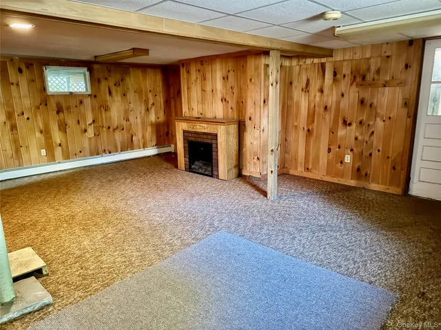a view of an empty room with a fireplace