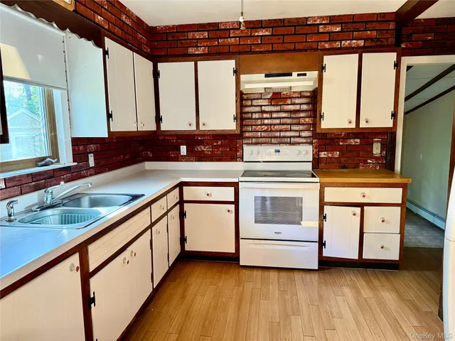 a kitchen with a stove and a sink