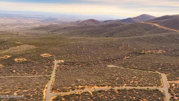 a view of mountains and valleys