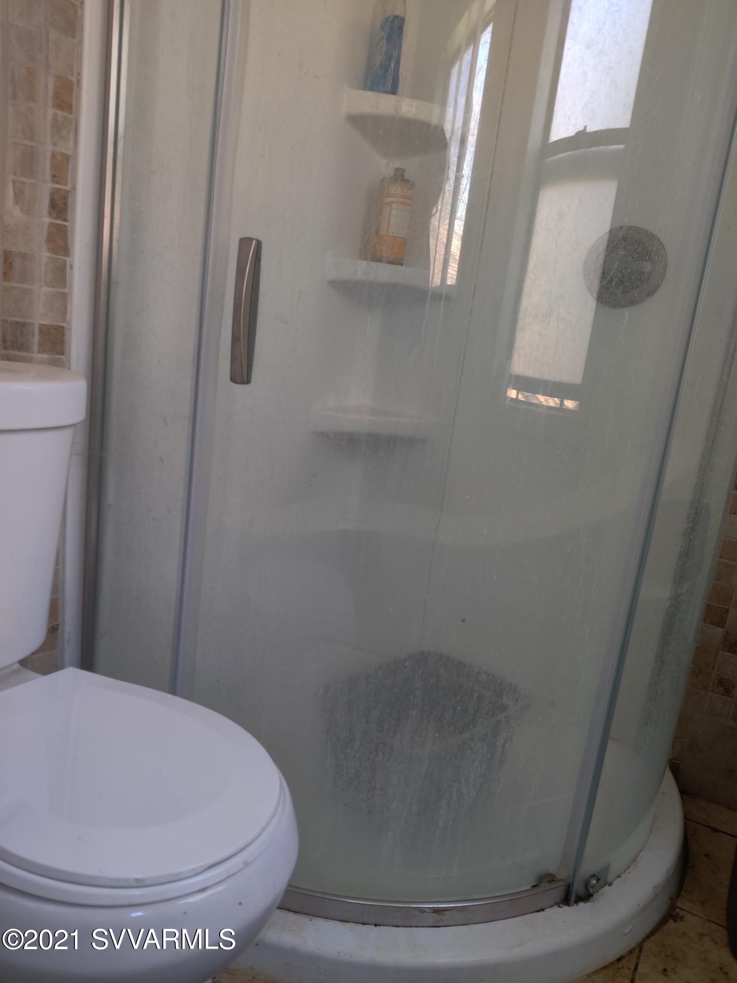 4330 East Beaver Vista Road Rimrock, AZ 86335 - Photo 11 of 15 a bathroom with a toilet and a shower