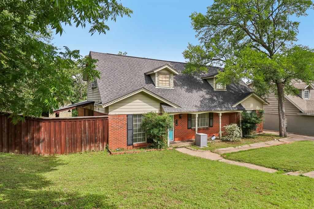 820 North Bowen Road Arlington, TX 76012 - Photo 2 of 40 a front view of a house with a yard