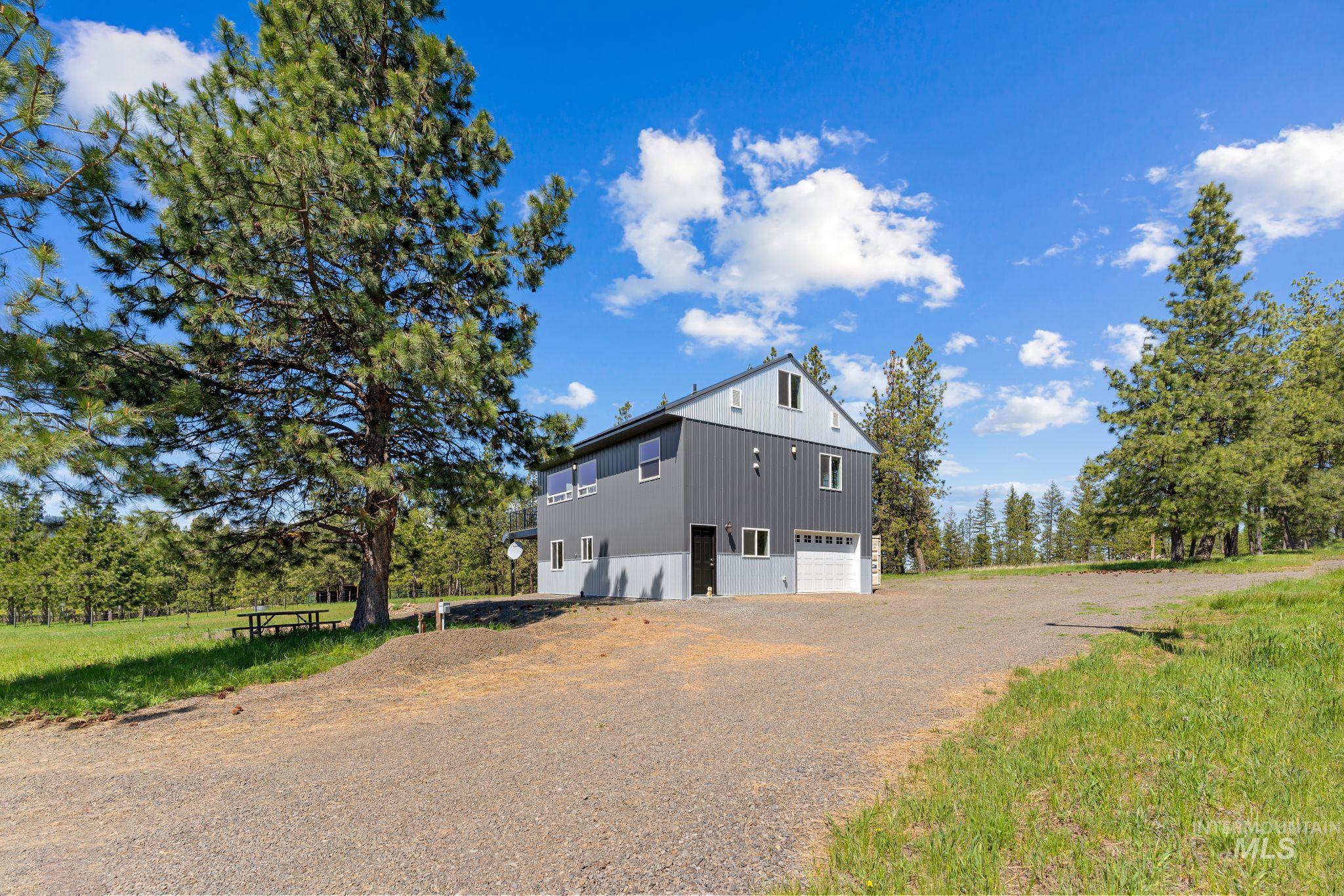 507 Bearlea Road Anatone, WA 99401 - Photo 1 of 47 Contemporary two-story residence with a multi-tone panel exterior
