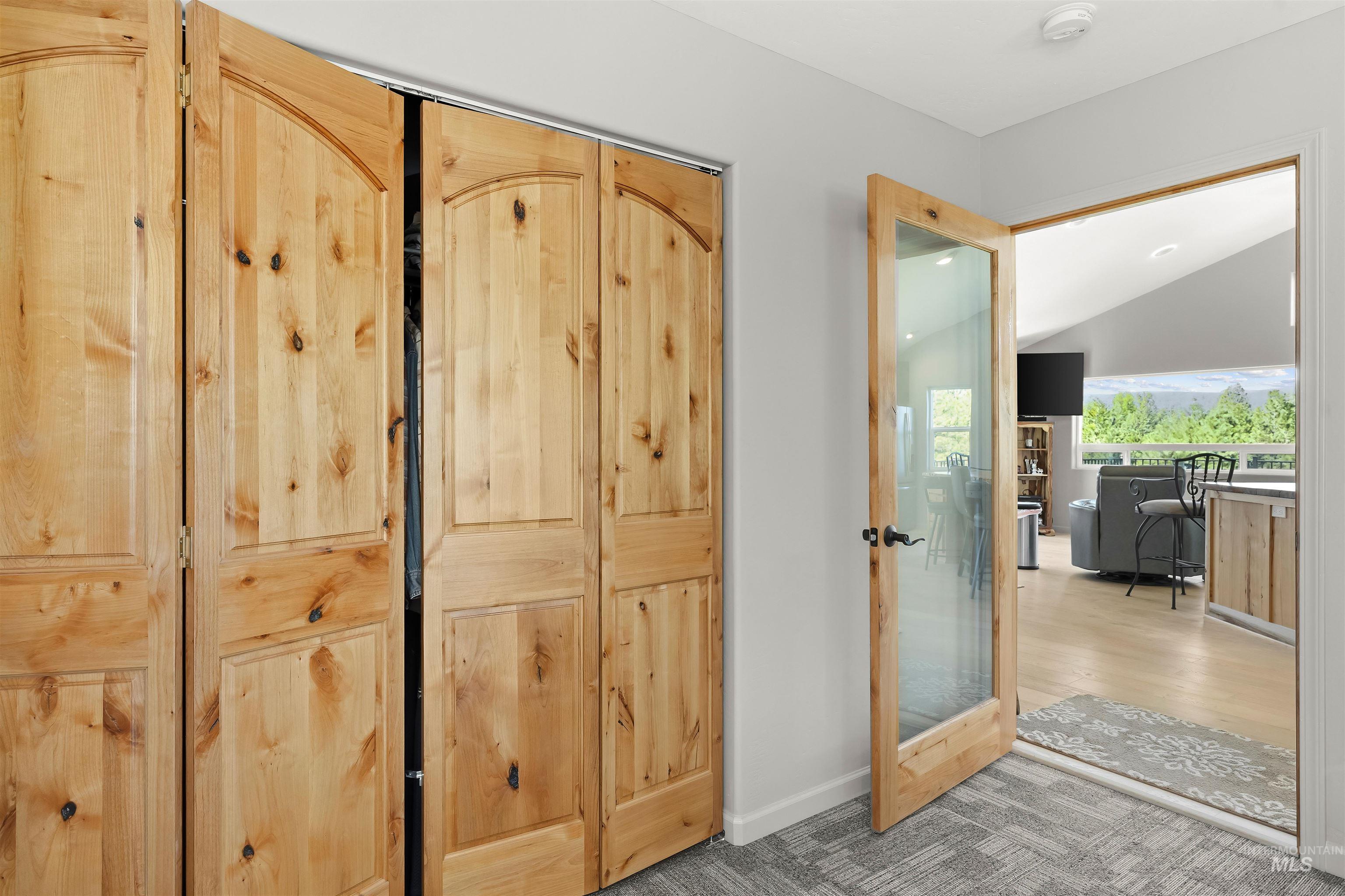 507 Bearlea Road Anatone, WA 99401 - Photo 16 of 47 Natural wood bi-fold doors with arched panels