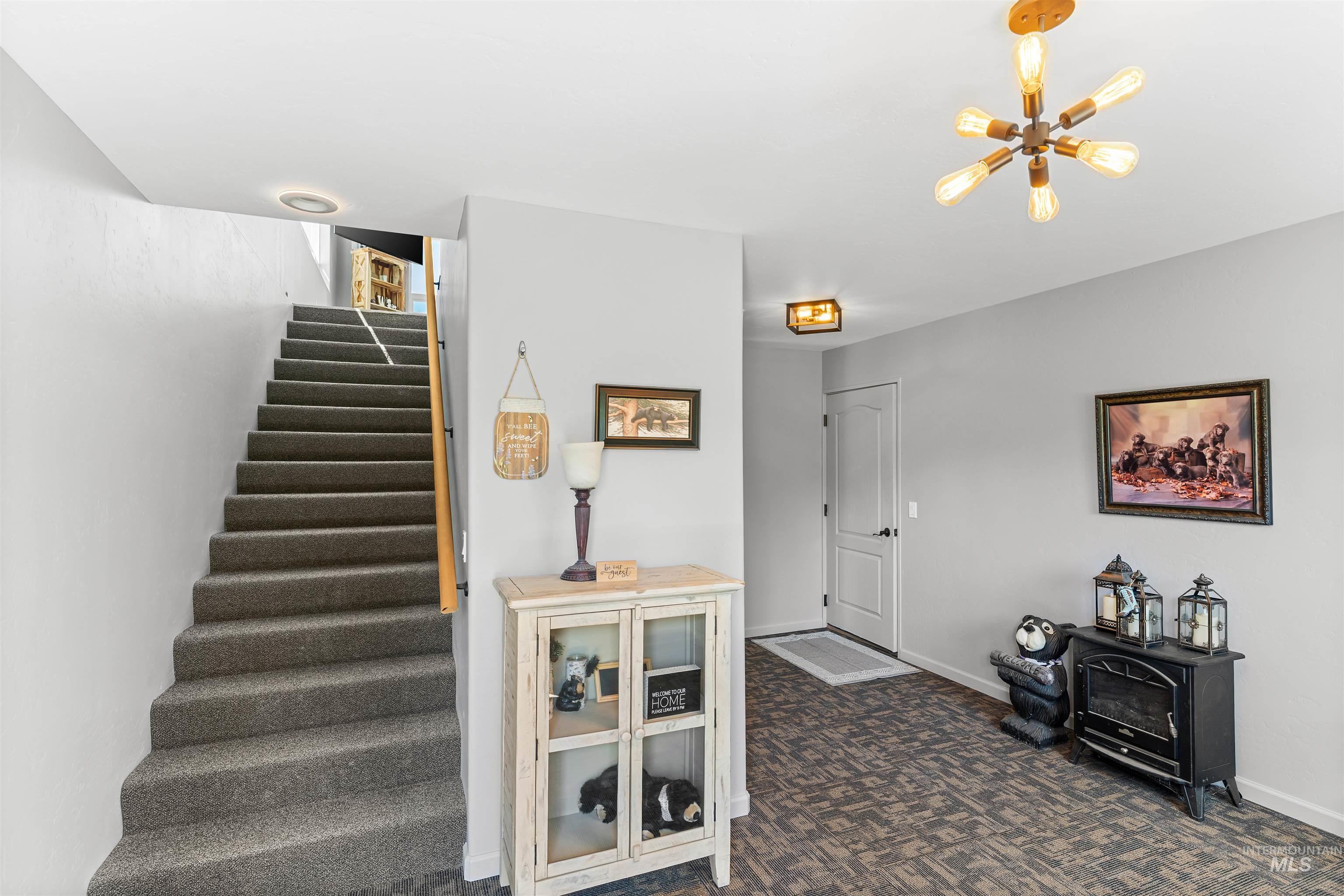 507 Bearlea Road Anatone, WA 99401 - Photo 19 of 47 Carpeted staircase with light wood handrail
