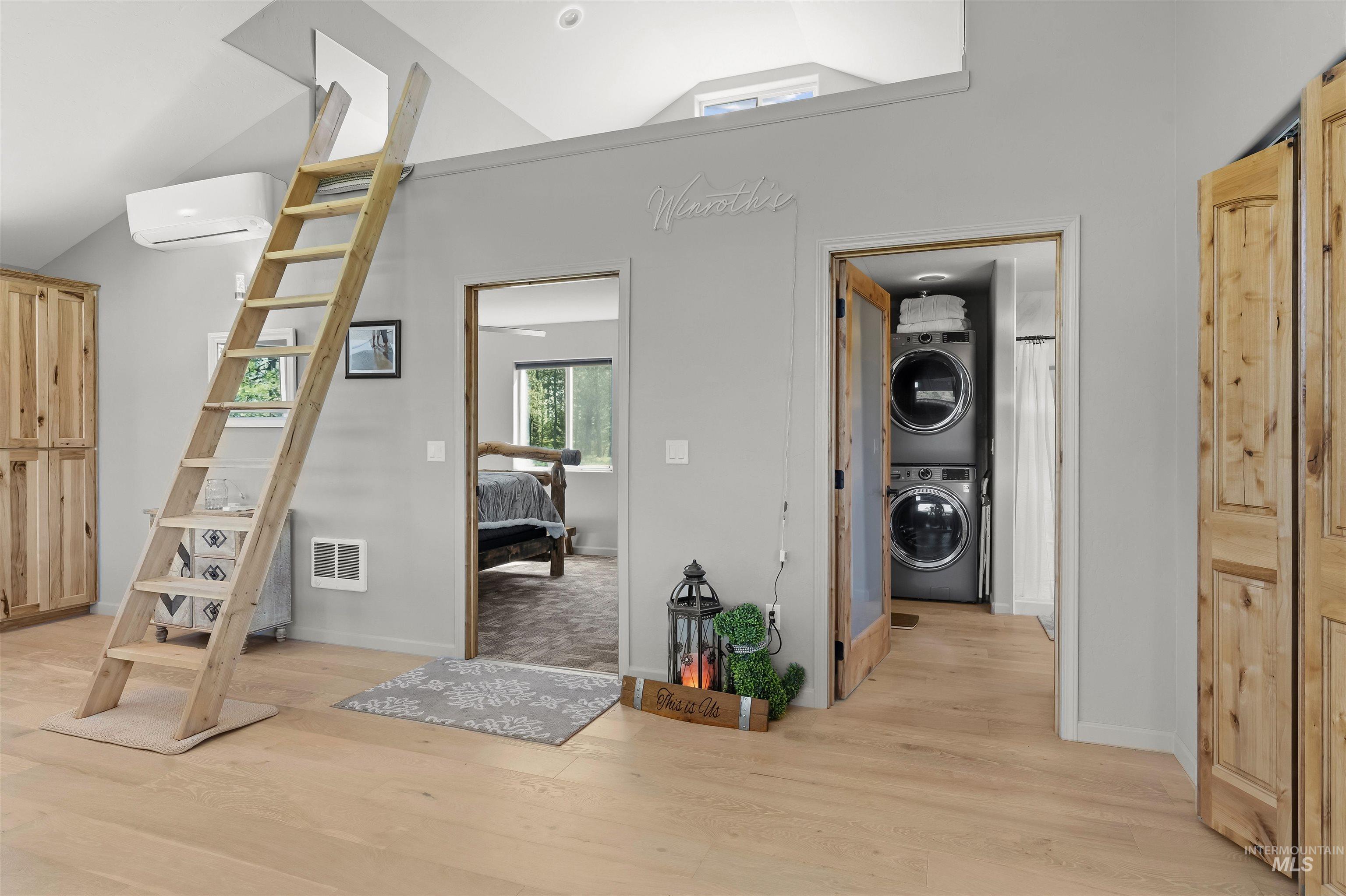 507 Bearlea Road Anatone, WA 99401 - Photo 7 of 47 Light wood-finish flooring throughout, featuring a natural wood-toned ladder to an upper loft space