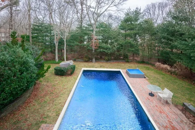 a view of swimming pool with lounge chair