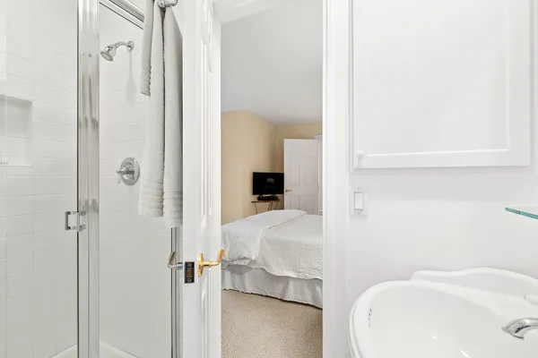 a bathroom with a sink and shower