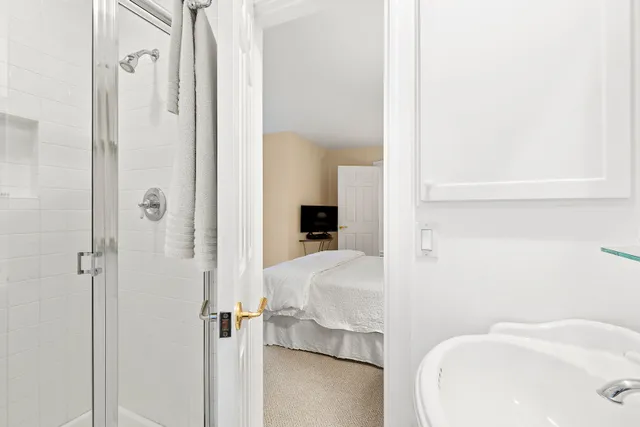 a bathroom with a sink and shower