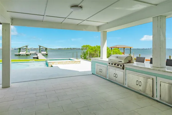 a large bathroom with a sink and mirror