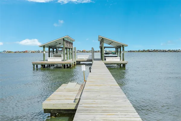 a view of balcony with wooden floor and outdoor seating