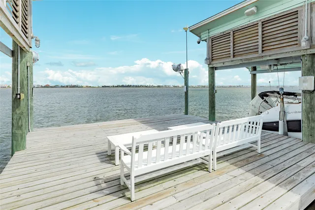 a open kitchen with granite countertop a sink and cabinets