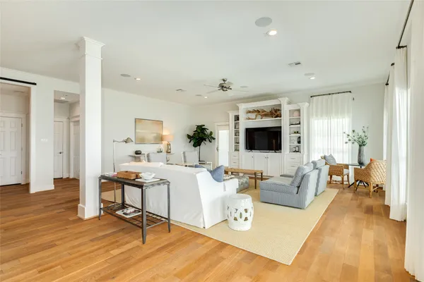 a living room with fireplace furniture and a flat screen tv