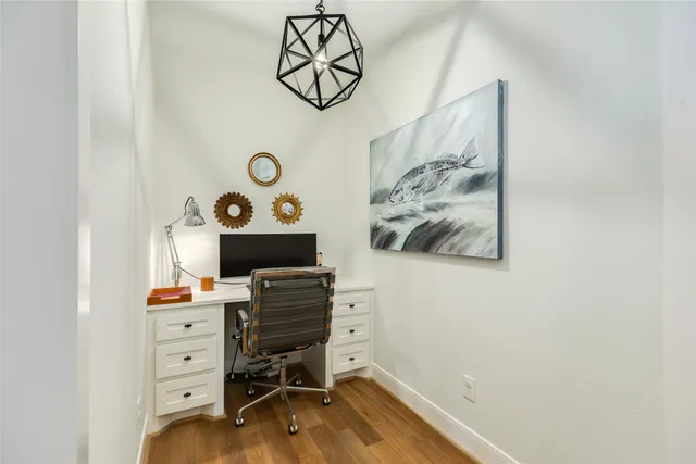 a kitchen with a sink cabinets stainless steel appliances and a window