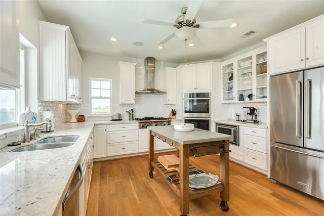 a kitchen with a sink cabinets and window
