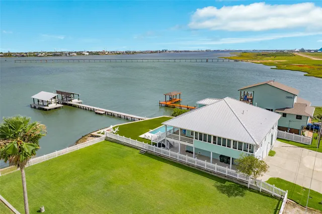 a view of a house with pool and deck