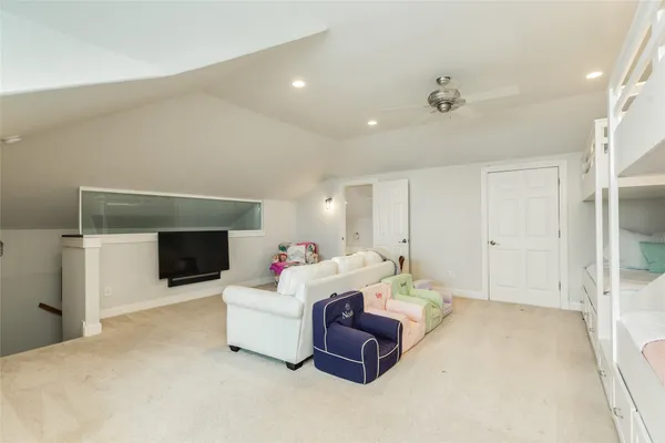 a bedroom with a bed and a couch