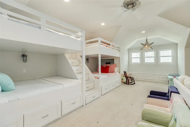 a bathroom with a double vanity sink and mirror with toilet