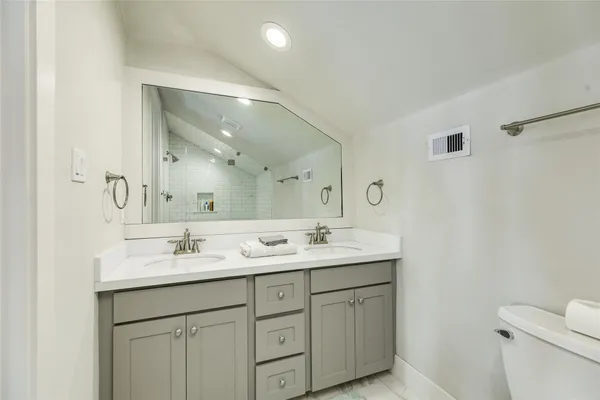 a kitchen with microwave a stove and furniture