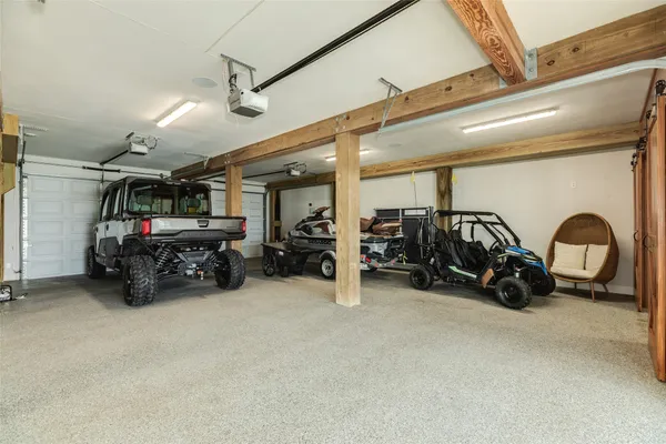 a view of a garage with parked cars