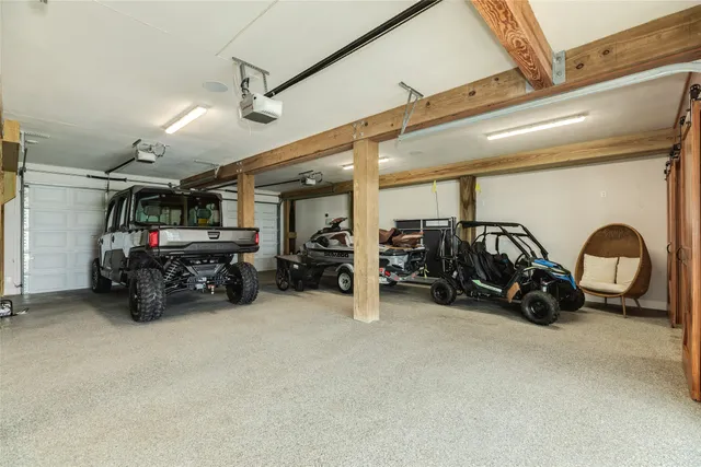 a view of a garage with parked cars