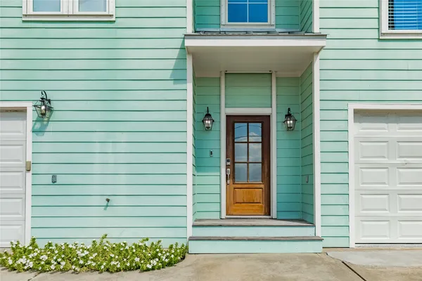 a view of a patio with table and chairs and wooden floor