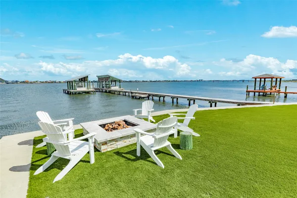a balcony with table and chairs