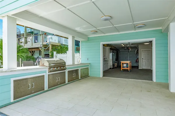 a view of a kitchen with furniture and a sink