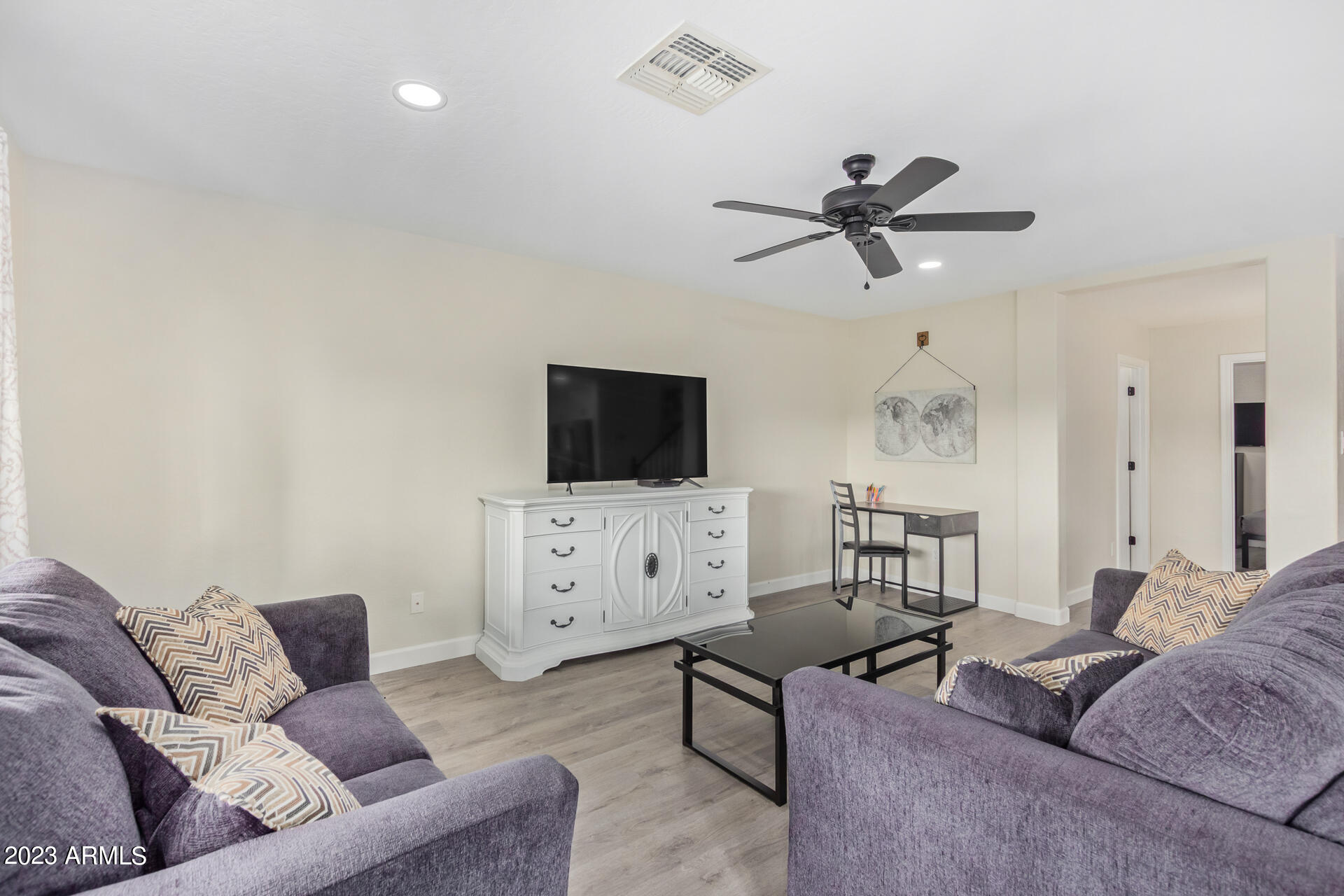 2561 West Tanner Ranch Road Queen Creek, AZ 85144 - Photo 12 of 36 a living room with furniture and a flat screen tv